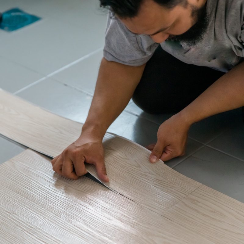 vinyl-floor-installation-worker-diy-at-home-.jpg